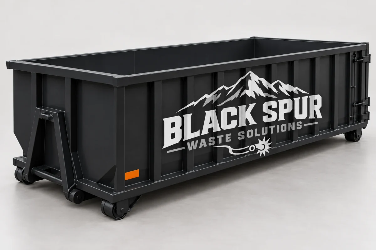Illustrative black steel roll-off dumpster with an open top
